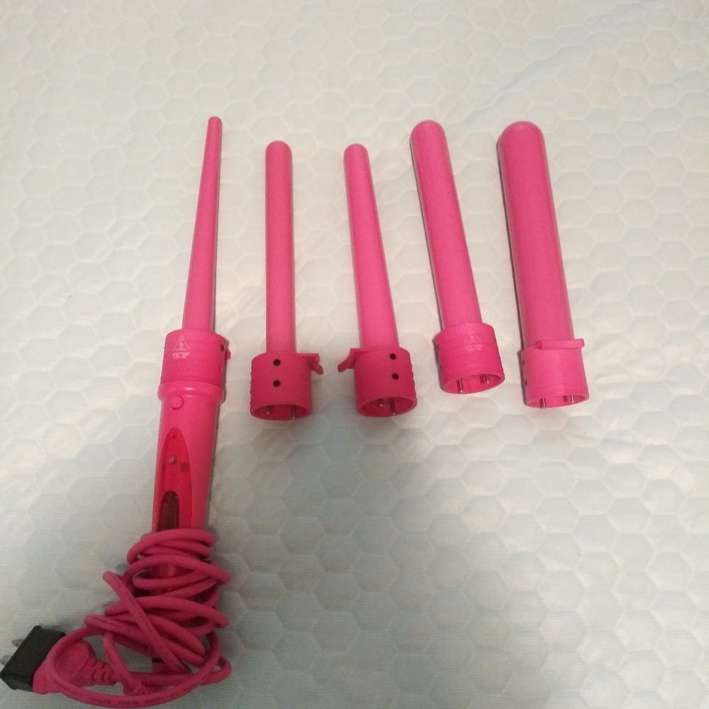 Pink curling iron with adjustable wonds.